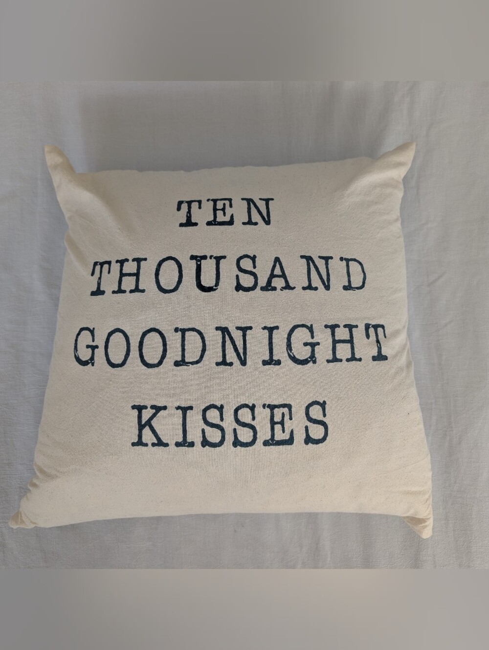 Cream Decorative Throw Pillow with Navy Text - Ten Thousand Goodnight Kisses